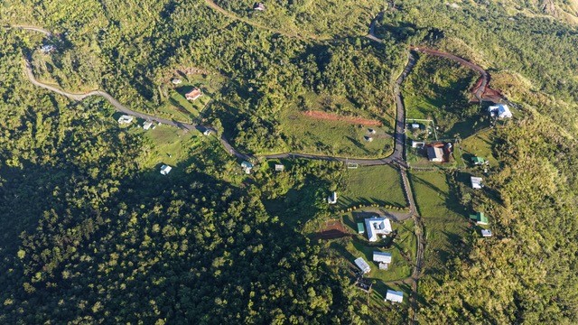 The peaceful highlands of Nadarivatu, with homes and roads nestled among green hills.