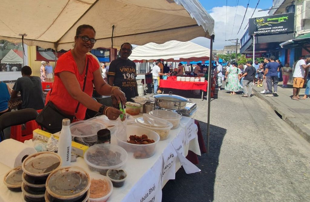 Serving up Indian delicacies with a smile. One of many stalls at the popular ROC Market in Suva, Fiji. EXPLORE Fiji photo.