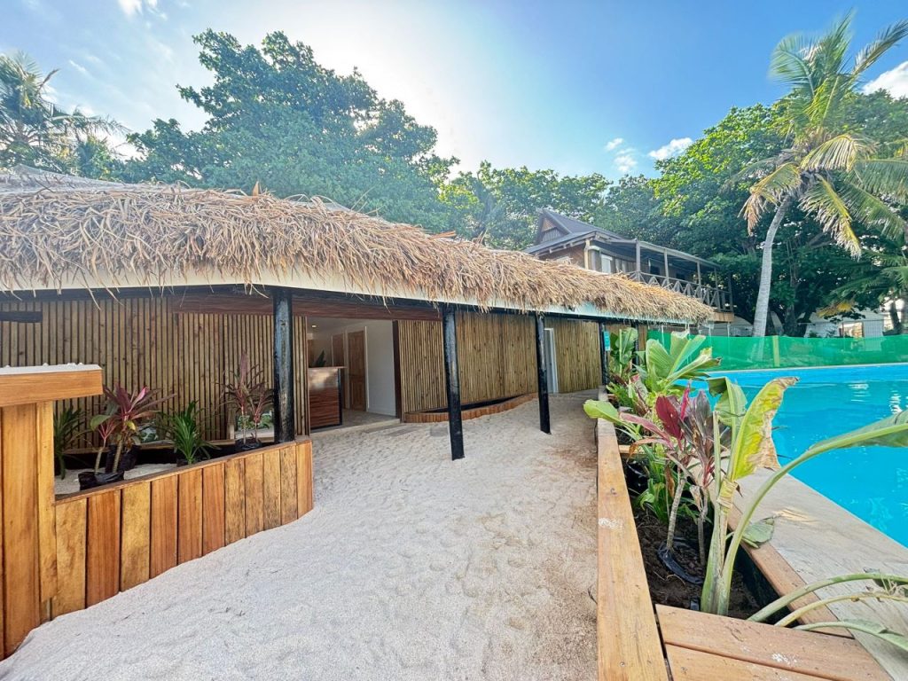 Exterior of the Day Spa at Beachcomber Island Resort, Fiji — a tranquil retreat located beside the pool and ocean.