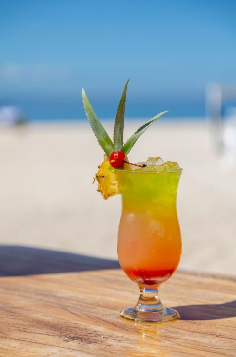 Vibrant cocktail creations at Beachcomber Island Resort, Fiji, perfect for sunset sips by the sea.