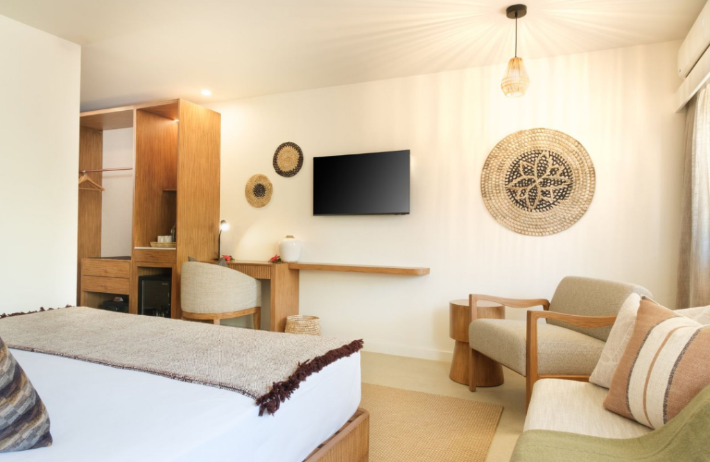 Deluxe King Room interior at Fiji Gateway Hotel Nadi with contemporary Fijian design and handcrafted wall art