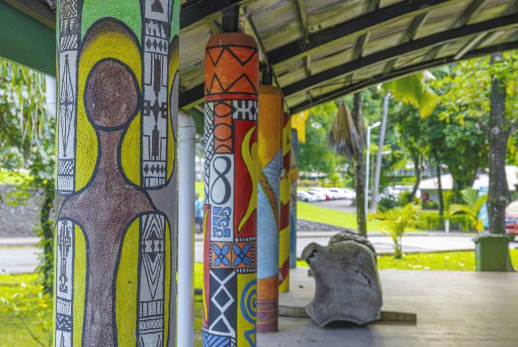 Painted concrete posts on the University of the South Pacific campus created by Oceania Centre artists between 2010 and 2012, featuring vibrant Pacific-inspired designs integrated into public infrastructure