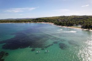 Aerial view of Natadola Beach Fiji coastline with white sand and clear blue ocean water