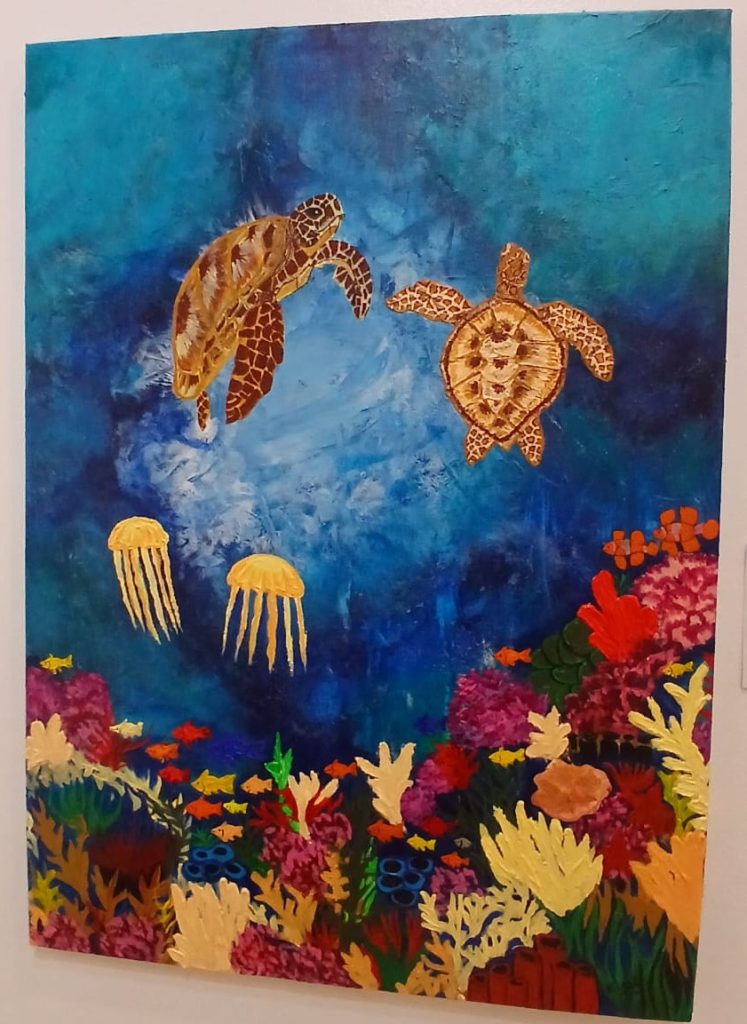 Kaajal Kristi's The Blue Sanctuary (2026), an acrylic on canvas painting depicting sea turtles and vibrant marine life in Fiji